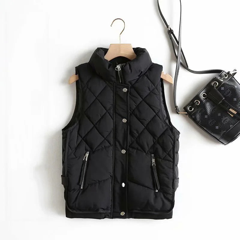 Women’s Ruby stand collar puffer vest by Christine Brewer, featuring a stylish quilted design and vibrant red color.