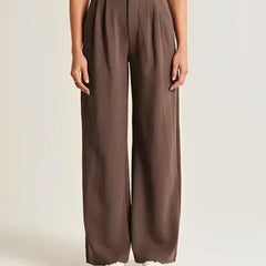 White wide-leg high-waist pants for women by Christine Brewer, featuring a relaxed fit and stylish high-rise design.