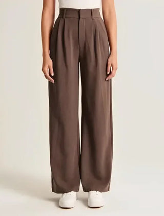 White wide-leg high-waist pants for women by Christine Brewer, featuring a relaxed fit and stylish high-rise design.