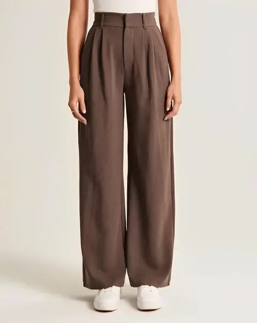 White wide-leg high-waist pants for women by Christine Brewer, featuring a relaxed fit and stylish high-rise design.