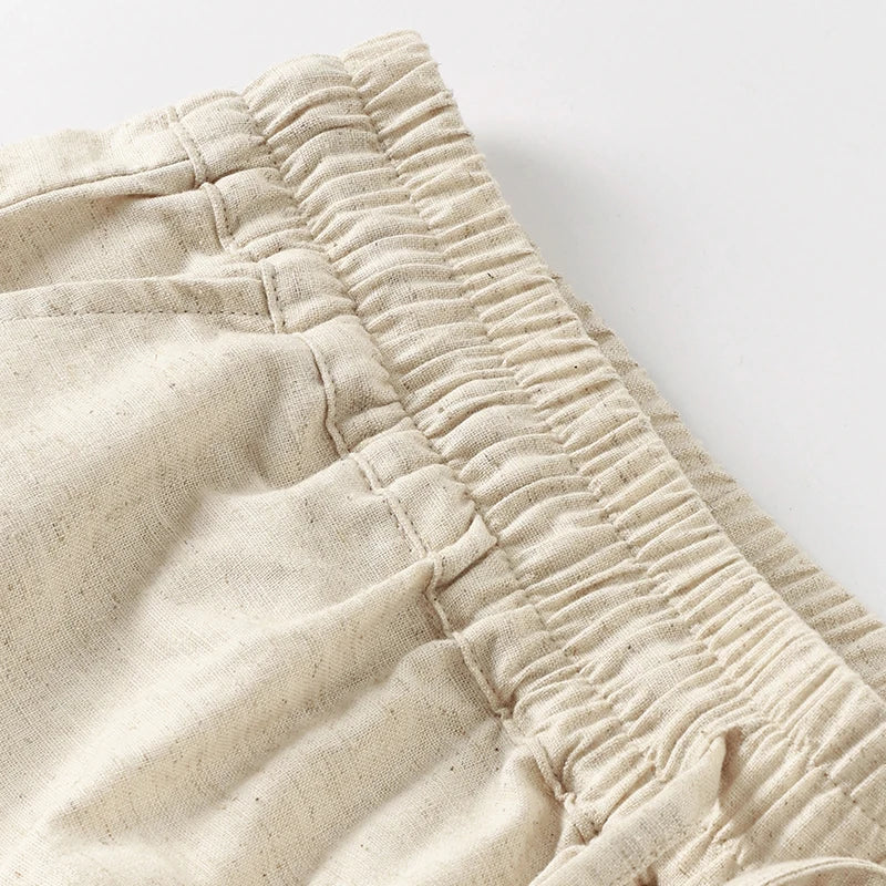 Women’s cotton linen wide leg pull-on trousers by Christine Brewer, featuring a relaxed fit and drawstring waist.
