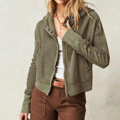 Mia cropped hooded hoodie for women by Christine Brewer, featuring a relaxed fit and drawstring hood, shown in a stylish casual setting.