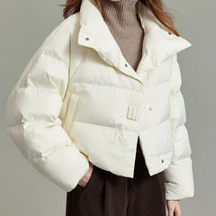 Women’s cropped quilted parka by Christine Brewer, featuring a stylish, warm design with a fitted silhouette and quilted exterior.