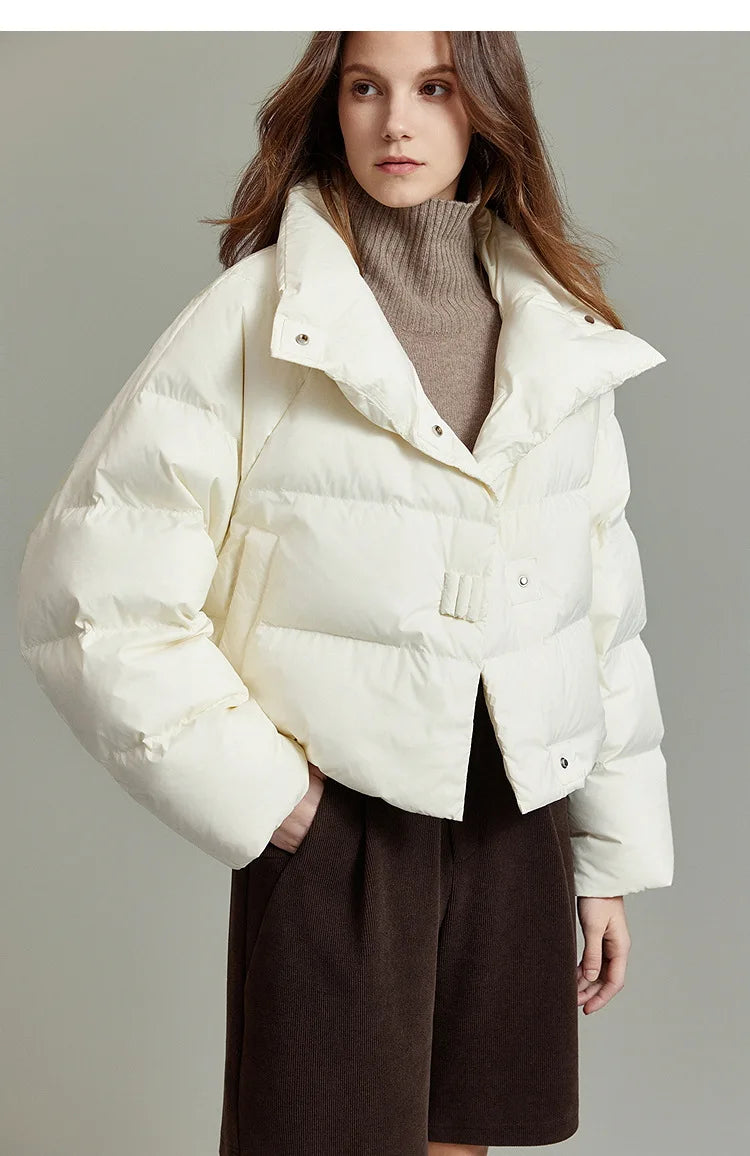 Women’s cropped quilted parka by Christine Brewer, featuring a stylish, warm design with a fitted silhouette and quilted exterior.