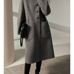 Green long wool coat for women by Christine Brewer, featuring a stylish and cozy design perfect for cold weather.