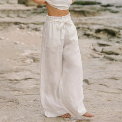 Women’s linen wide-leg trousers by Christine Brewer, loose pull-on pants with relaxed fit, showcased in a neutral fabric.