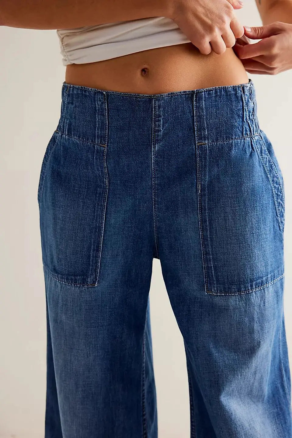Blue denim wide-leg women's jeans by Christine Brewer, relaxed fit casual pants featuring a stylish, comfortable design.