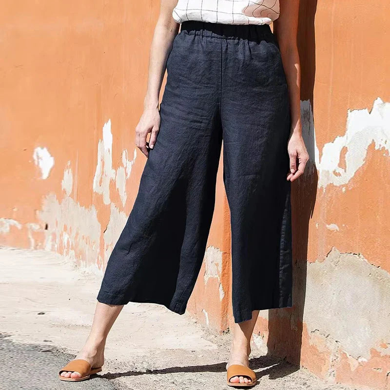 Women’s linen cropped wide-leg drawstring trousers by Christine Brewer, featuring a loose, pull-on design and relaxed fit.