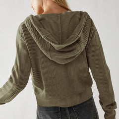 Woman wearing a cropped hooded hoodie from Christine Brewer's Mia collection, showcasing the casual, comfortable design.