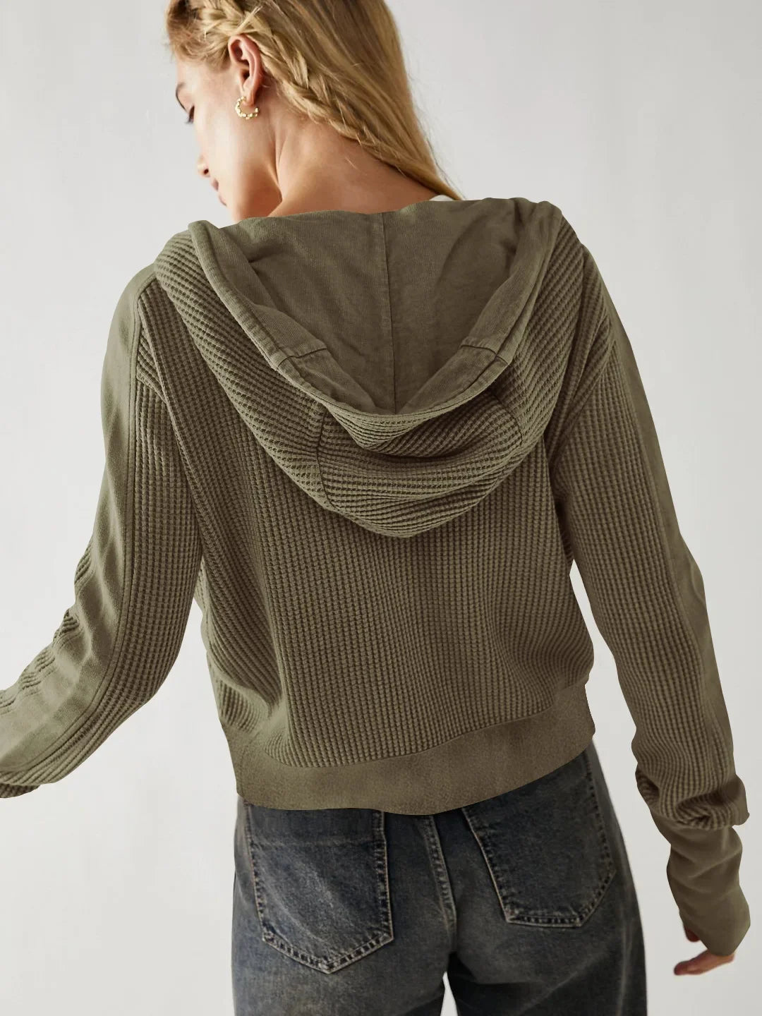 Woman wearing a cropped hooded hoodie from Christine Brewer's Mia collection, showcasing the casual, comfortable design.