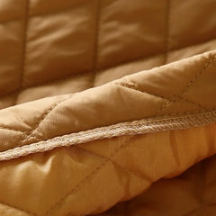 Longline Elena puffer jacket for women by Christine Brewer, featuring a warm, quilted design and a stylish oversized fit.
