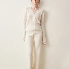 Elsa cashmere cardigan for women by Christine Brewer, soft beige knit with button details and ribbed cuffs.