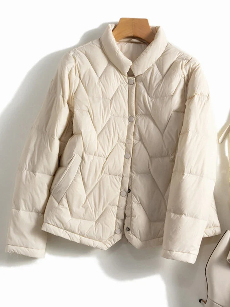 Christine Brewer Aurora short quilted puffer jacket for women, lightweight winter coat with a quilted design and stand collar.