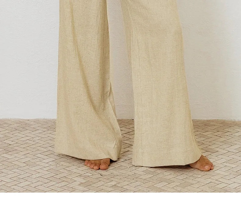 Light beige linen wide-leg trousers for women, loose pull-on style by Christine Brewer, shown on a model.