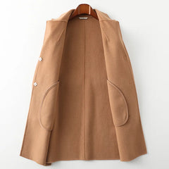 Olivia long belted wool coat for women by Christine Brewer, featuring a tailored fit and classic design, shown on a model.
