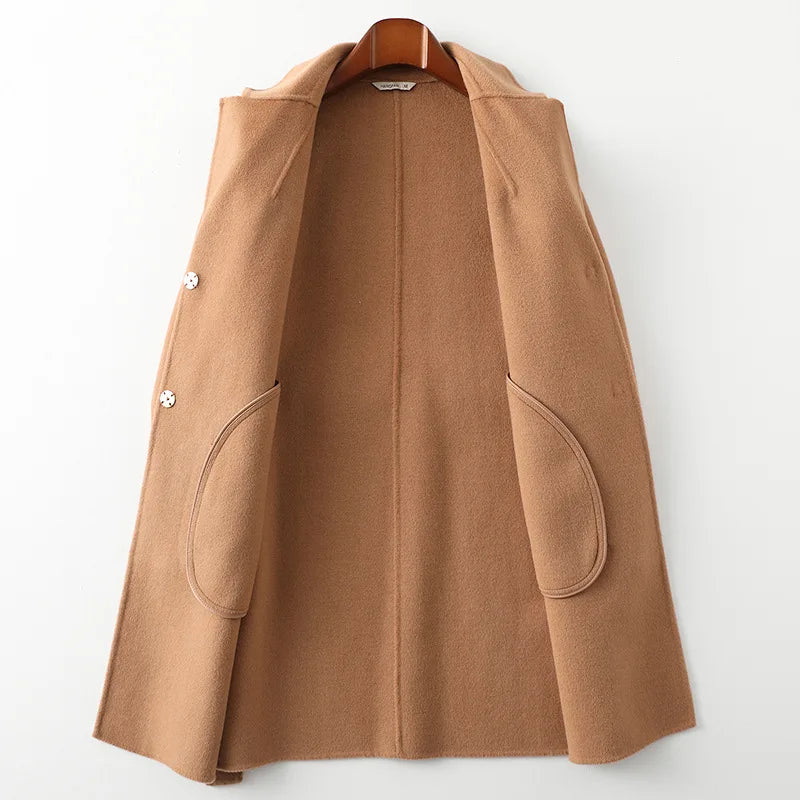 Olivia long belted wool coat for women by Christine Brewer, featuring a tailored fit and classic design, shown on a model.