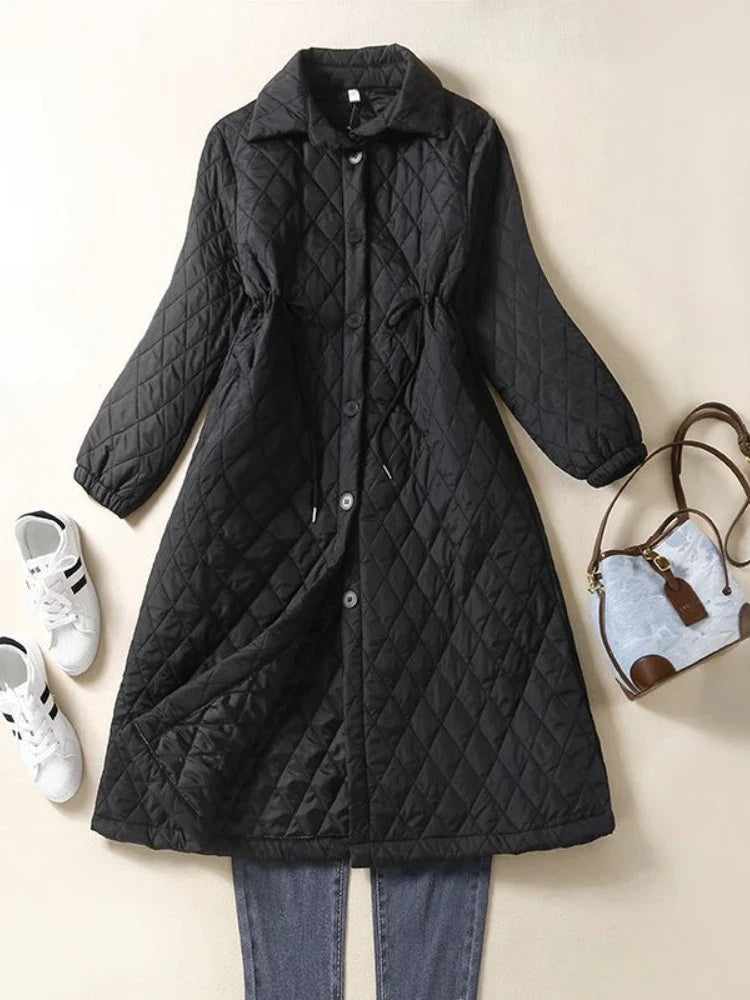 Longline Elena puffer jacket for women by Christine Brewer, featuring a warm, quilted design and a stylish, oversized fit.