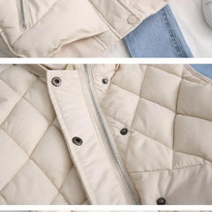 Ruby stand collar puffer vest for women by Christine Brewer, featuring a quilted design and sleek silhouette.