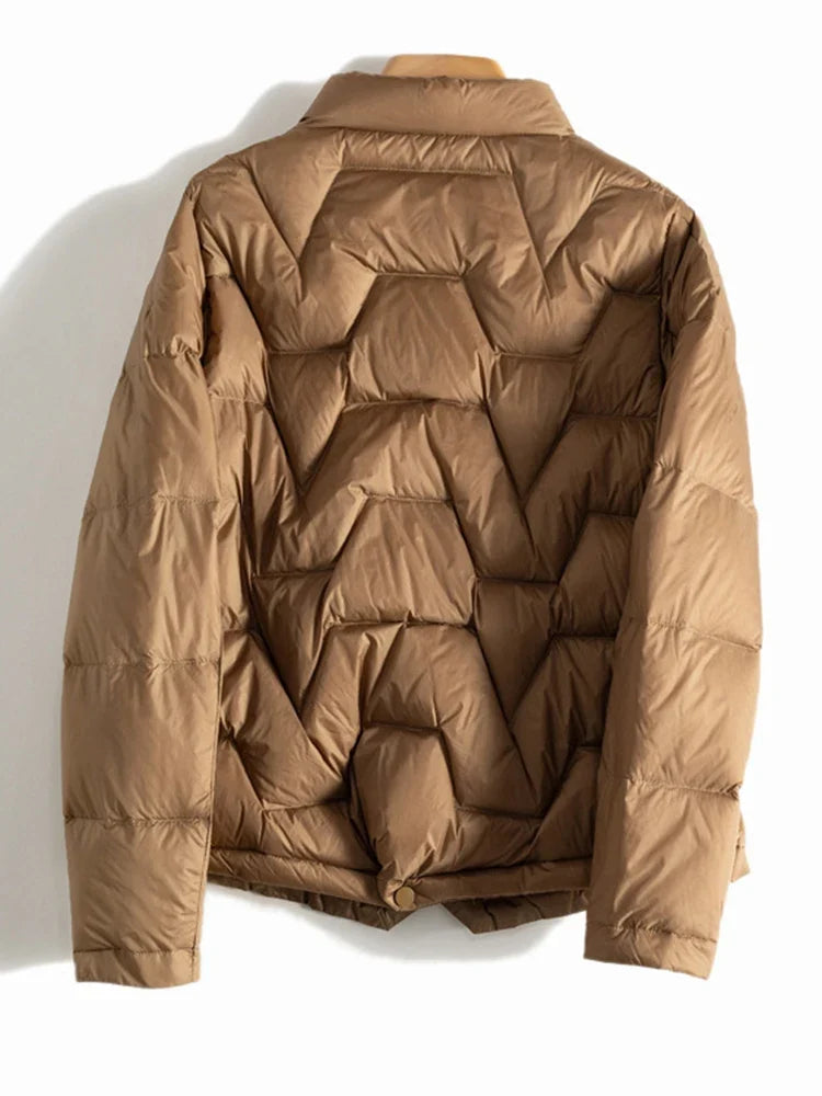 Women’s Aurora short quilted puffer jacket by Christine Brewer, featuring a stylish, insulated design for cold weather.