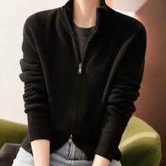 Women’s wool zip-up cardigan by Christine Brewer, featuring a stylish jean-inspired knit design with a front zipper.