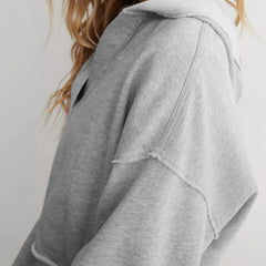 Christine Brewer Eleanor cropped hoodie for women, featuring a stylish, comfortable design in soft fabric, shown in a close-up view.