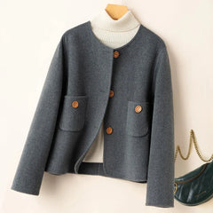Elegant wool coat for women by Christine Brewer, featuring a tailored fit and classic design in a neutral color.