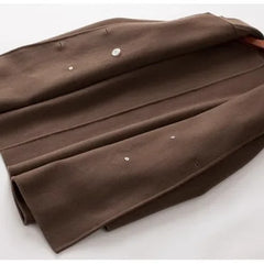 Brown double-breasted wool coat for women by Christine Brewer, featuring classic styling and tailored fit.