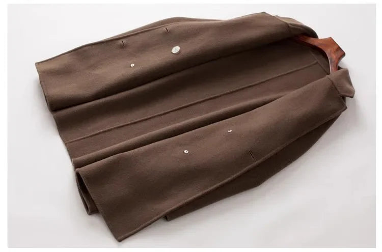 Brown double-breasted wool coat for women by Christine Brewer, featuring classic styling and tailored fit.
