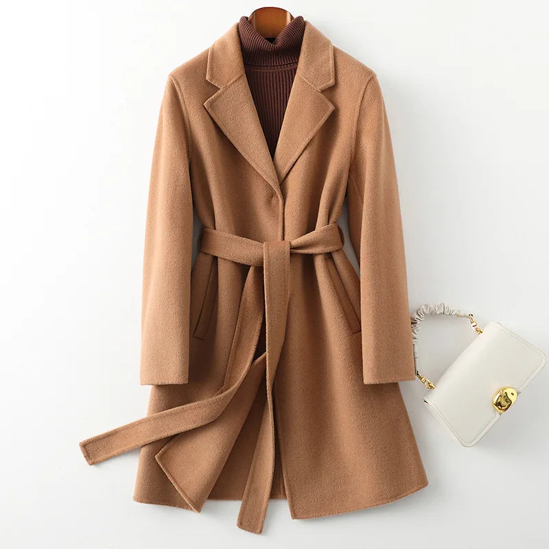 Olivia long belted wool coat for women by Christine Brewer, shown in a stylish, tailored design with a belt and classic wool fabric.