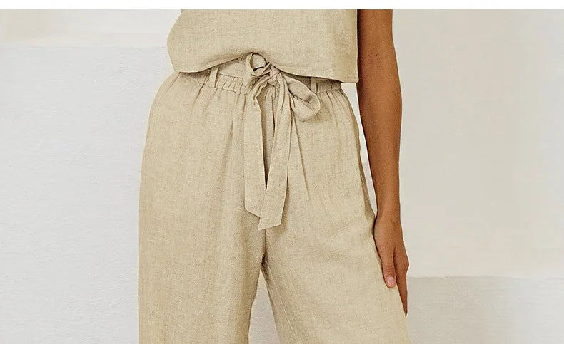 Women’s linen wide-leg trousers by Christine Brewer featuring loose, pull-on style and relaxed fit, perfect for casual wear.