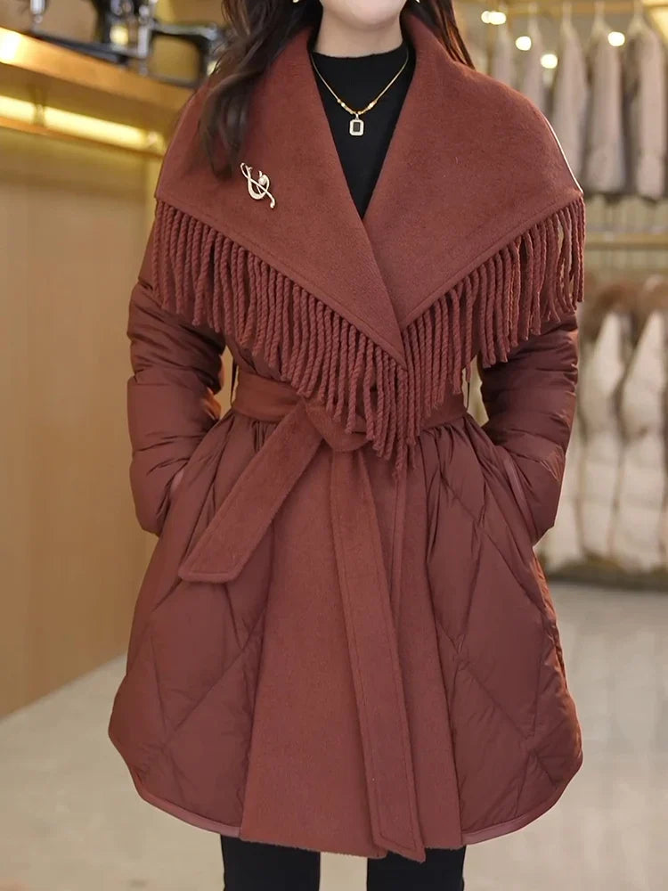 Christine Brewer Stella belted quilted puffer jacket for women, shown in a close-up of the stylish, insulated winter coat.