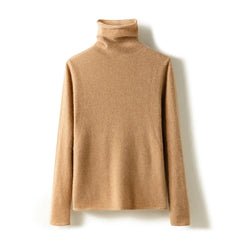 Cream-colored Gabrielle cashmere turtleneck sweater for women, featuring a cozy fit and ribbed collar, by Christine Brewer.