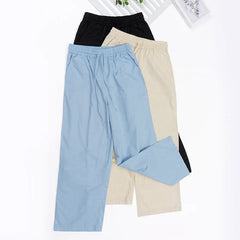 Women’s cotton linen wide-leg drawstring trousers by Christine Brewer, loose pull-on pants with relaxed fit and comfortable design.