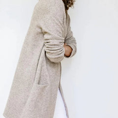 Jacqueline Merino Wool Cardigan for Women by Christine Brewer, showcasing a cozy, fitted knit sweater in a neutral color.