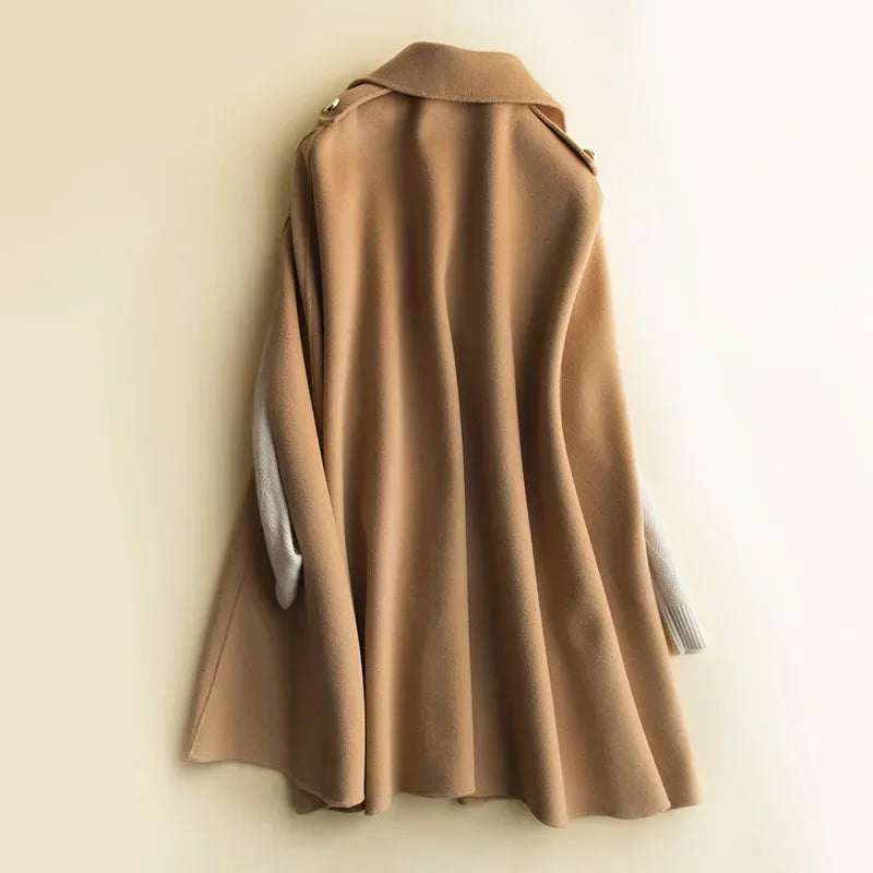 Elegant women's cape coat called Ivy by Christine Brewer, shown in a stylish, draped design with a sophisticated silhouette.