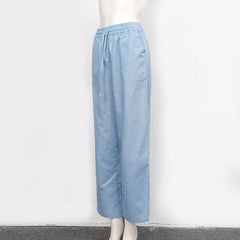 Women's cotton linen wide-leg drawstring trousers by Christine Brewer, loose pull-on pants with relaxed fit and comfortable style.