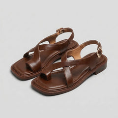 Square-toe block-heel criss-cross sandals for women by Christine Brewer, featuring stylish design and comfortable fit.