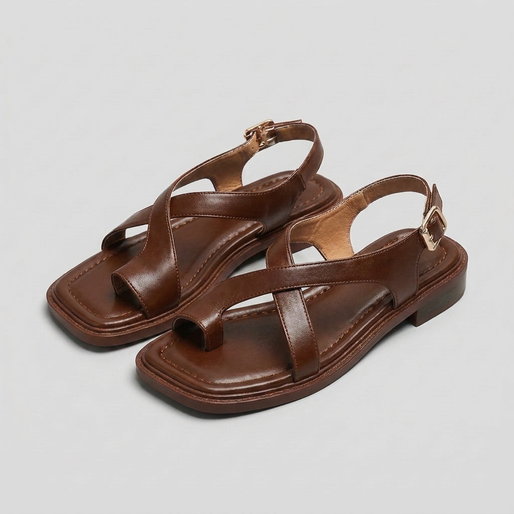 Square-toe block-heel criss-cross sandals for women by Christine Brewer, featuring stylish design and comfortable fit.