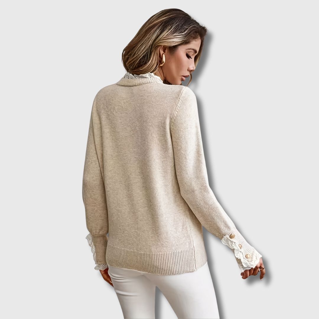 Women’s ribbed sweater by Christine Brewer featuring a cozy, fitted design in soft knit fabric, shown in a neutral color.