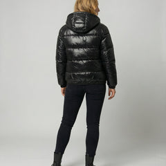 Unisex black Eva puffer jacket by Christine Brewer, shown from the back, featuring a cozy, quilted design for women and men.