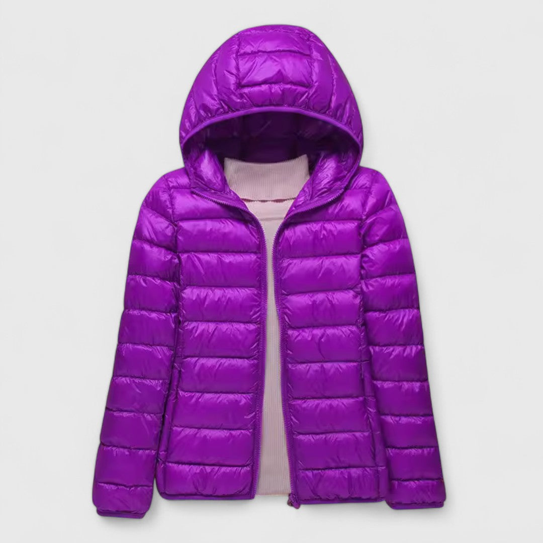 Light pink Christine Brewer Lily ultra-light quilted jacket with a sleek, padded design and stand-up collar.