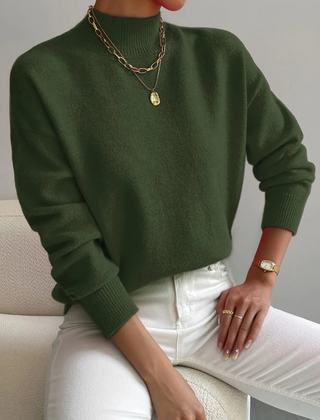 Cream-colored Samantha high neck sweater for women by Christine Brewer, featuring a cozy, fitted design with ribbed cuffs and hem.
