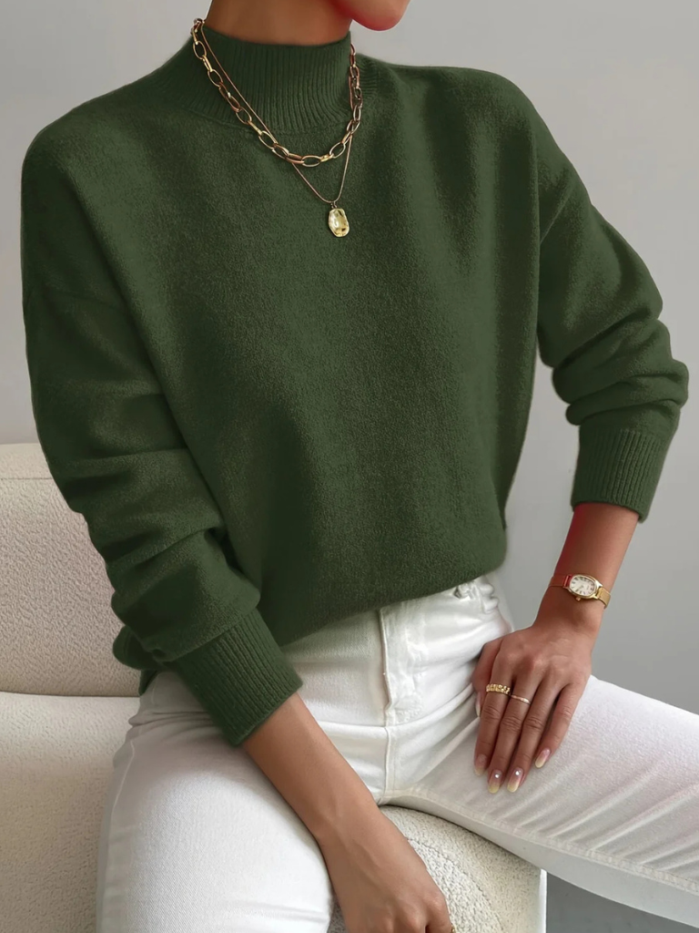 Cream-colored Samantha high neck sweater for women by Christine Brewer, featuring a cozy, fitted design with ribbed cuffs and hem.