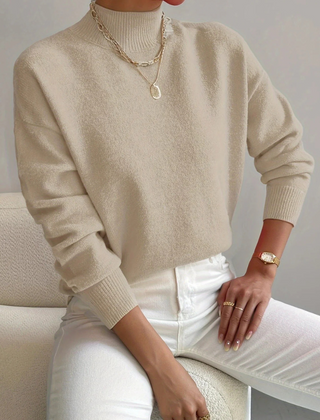 Women’s high neck sweater by Christine Brewer, Samantha style, featuring a cozy knit design and a classic fit in neutral color.