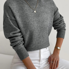 Cream-colored Samantha high neck sweater for women by Christine Brewer, shown on a model with a cozy, stylish fit.