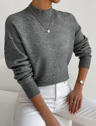 Cream-colored Samantha high neck sweater for women by Christine Brewer, shown on a model with a cozy, stylish fit.