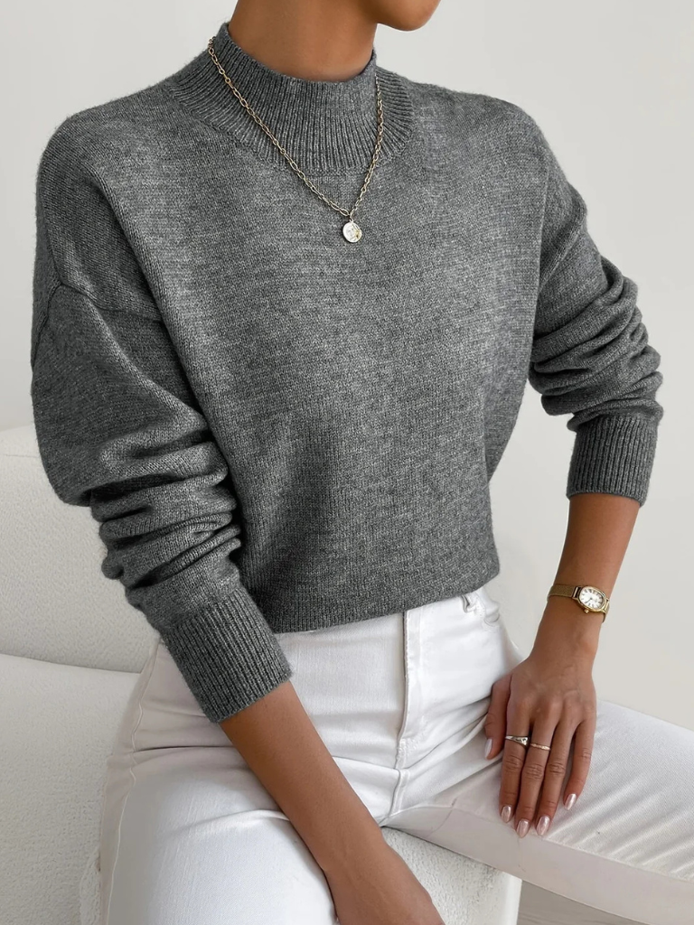 Cream-colored Samantha high neck sweater for women by Christine Brewer, shown on a model with a cozy, stylish fit.