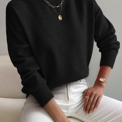 Cream-colored high neck sweater for women by Christine Brewer, featuring a cozy fit and ribbed texture.