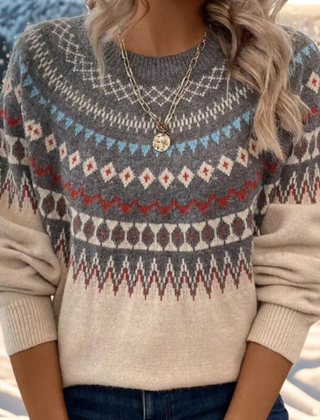 Cream-colored wool sweater for women by Christine Brewer, featuring a cozy, knit design with a high neckline and long sleeves.