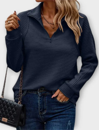 Katherine women's V-neck half-zip sweater by Christine Brewer, shown in a stylish, close-up image highlighting the neckline and fabric texture.